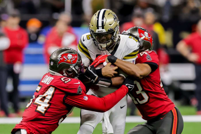 Tampa Bay linebacker Lavonte David (54) and cornerback Ross Cockrell (43) tackle Saints quarterback Jameis Winston (2). Mandatory Credit: Stephen Lew-USA TODAY Sports